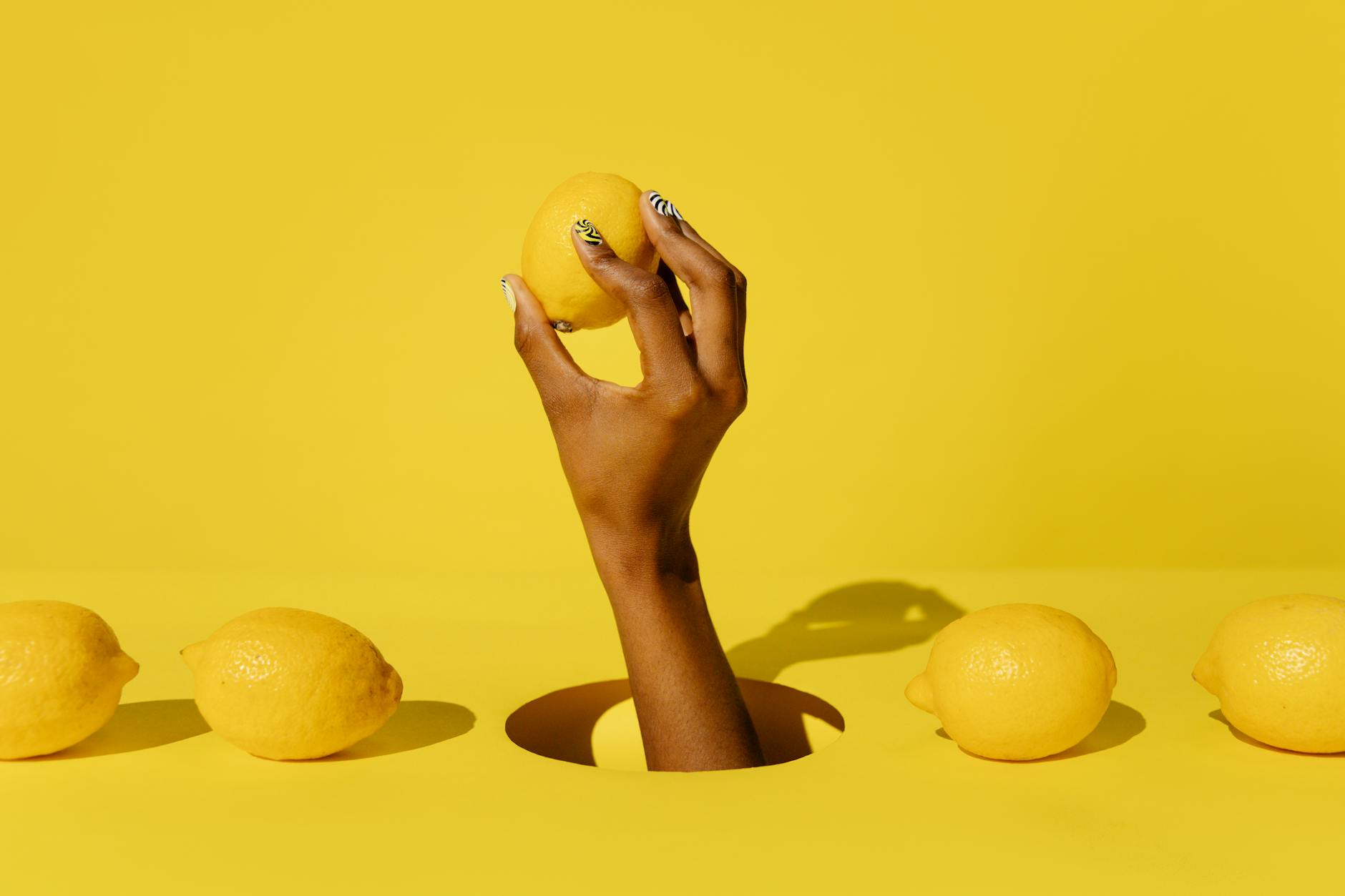 Colorful lemon vibrators arranged on white fabric, symbolizing diverse pathways to pleasure and self-discovery